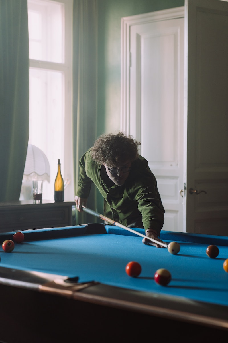 Man in Black Long Sleeve Shirt Playing Billiard